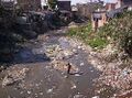 250px-Slum and dirty river.jpg